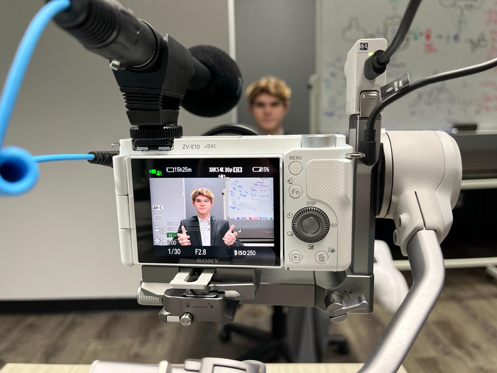 London Leffler recording on camera during his 2026 founder chapter